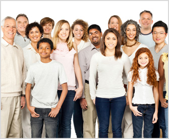 A group shot of men, women and children from diverse backgrounds in casual dress