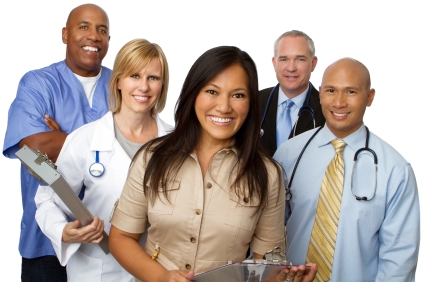 A group of smiling healthcare professionals dressed for various roles in practice 