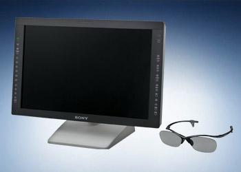 3D LCD monitor with screen off next to a pair of glasses with gray lenses